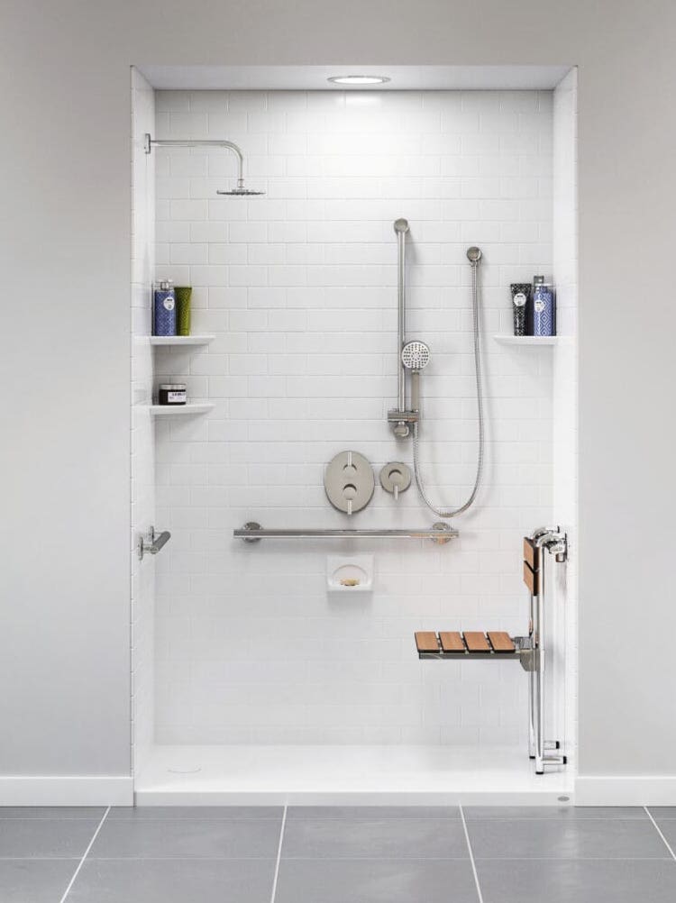 Sleek walk-in shower with a shower seat installed