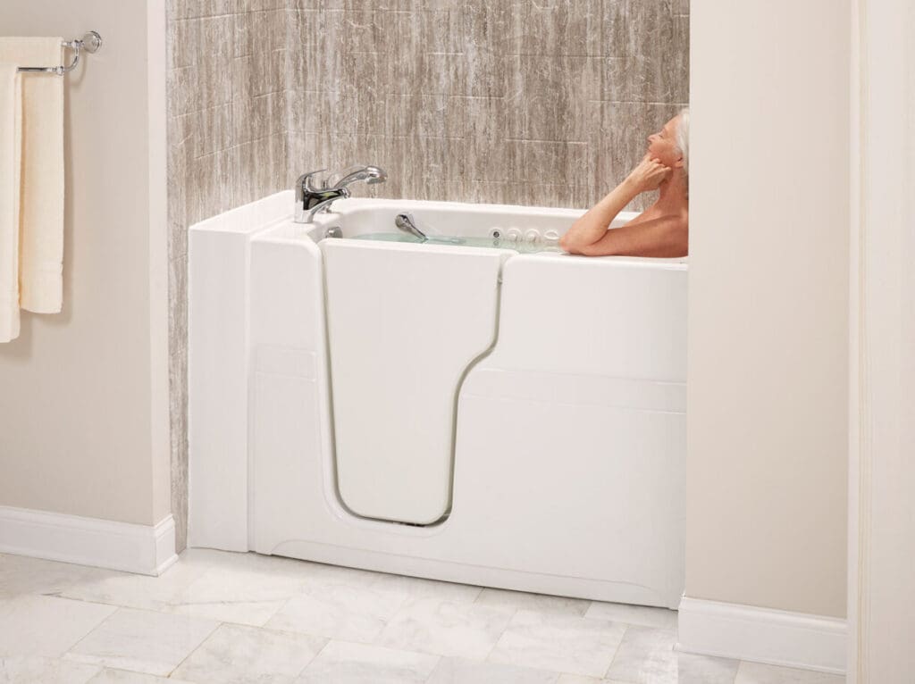 Elderly lady bathing in comfort inside her accessible walk-in tub