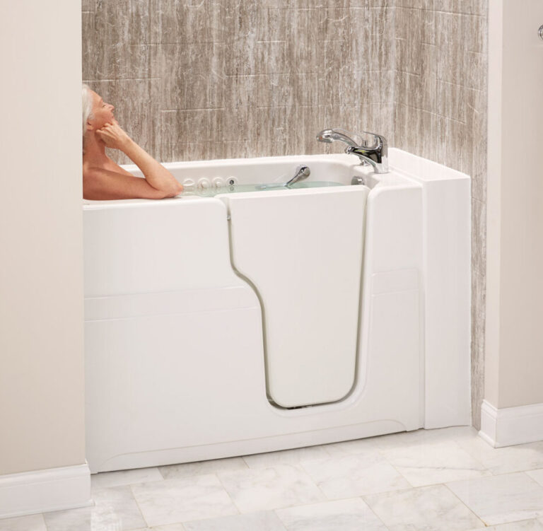 Elderly lady bathing in comfort inside her accessible walk-in tub